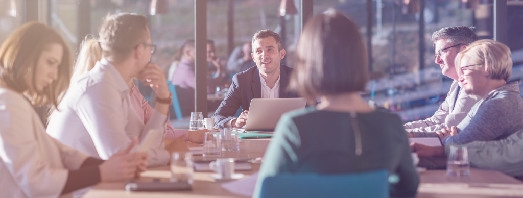 Colleagues collaborating around a table in a modern office